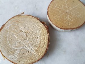 a picture of a bird etched on wood