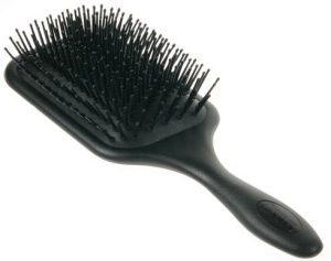a photo of a paddle brush by Denman